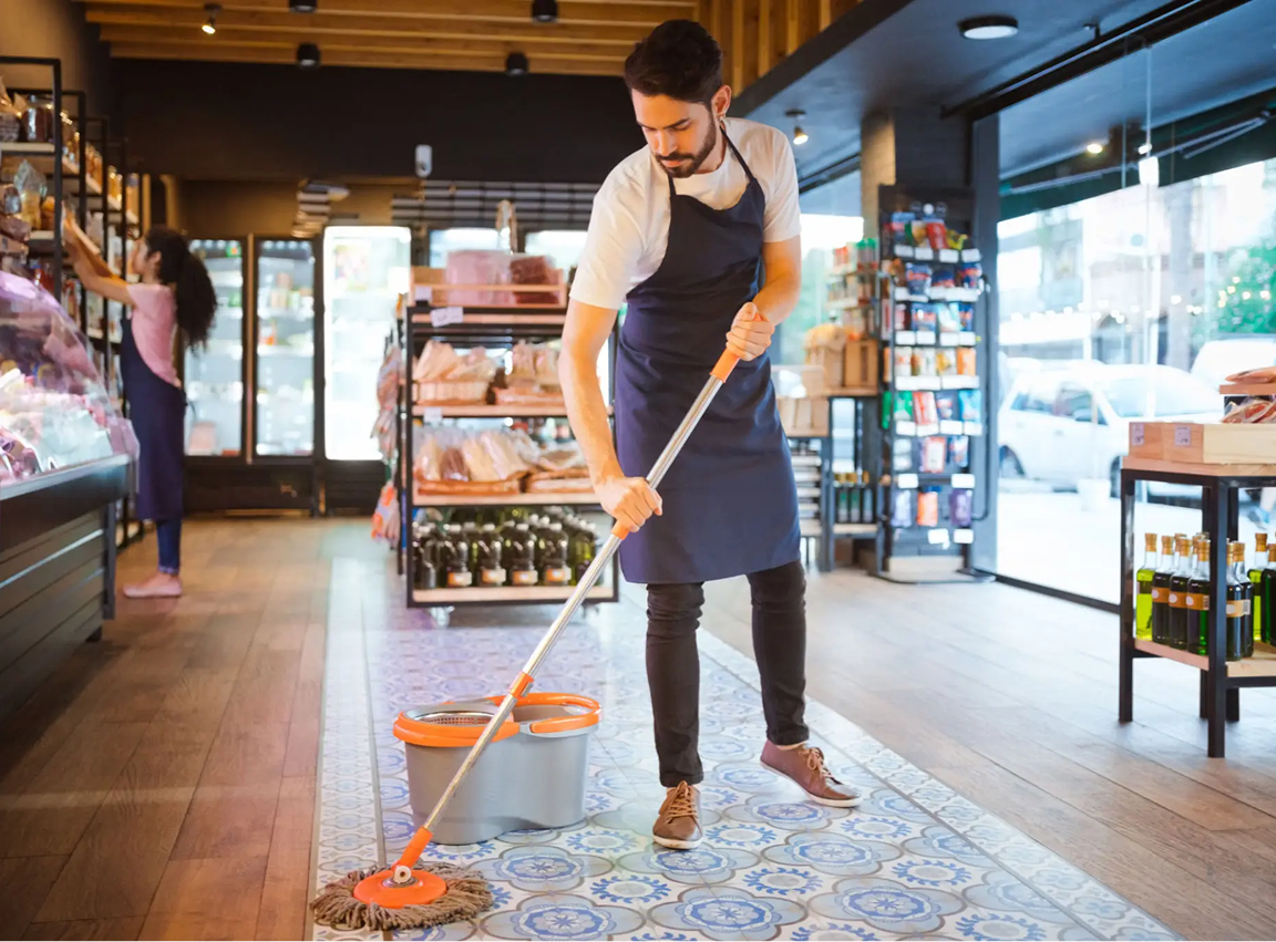 Man mopping floor in a store